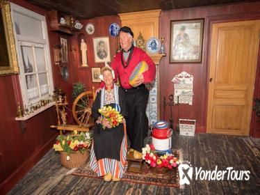 Picture in traditional Volendam costume and One-day bus ticket from Amsterdam