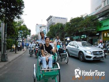 Saigon by Night: Cyclo Ride including Dinner on cruise