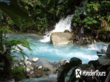 Blue Volcanic River Waterfalls and Hot Springs Mud Bath Adventure in Rincon de la Vieja from Playa Flamingo